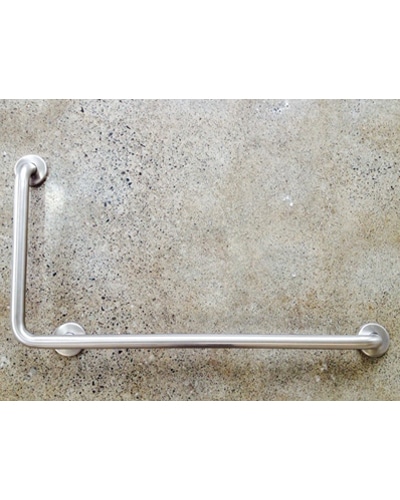 Grab Bars in stainless steel, L-shaped, are installed on a speckled light-colored wall to provide support and safety in bathrooms.