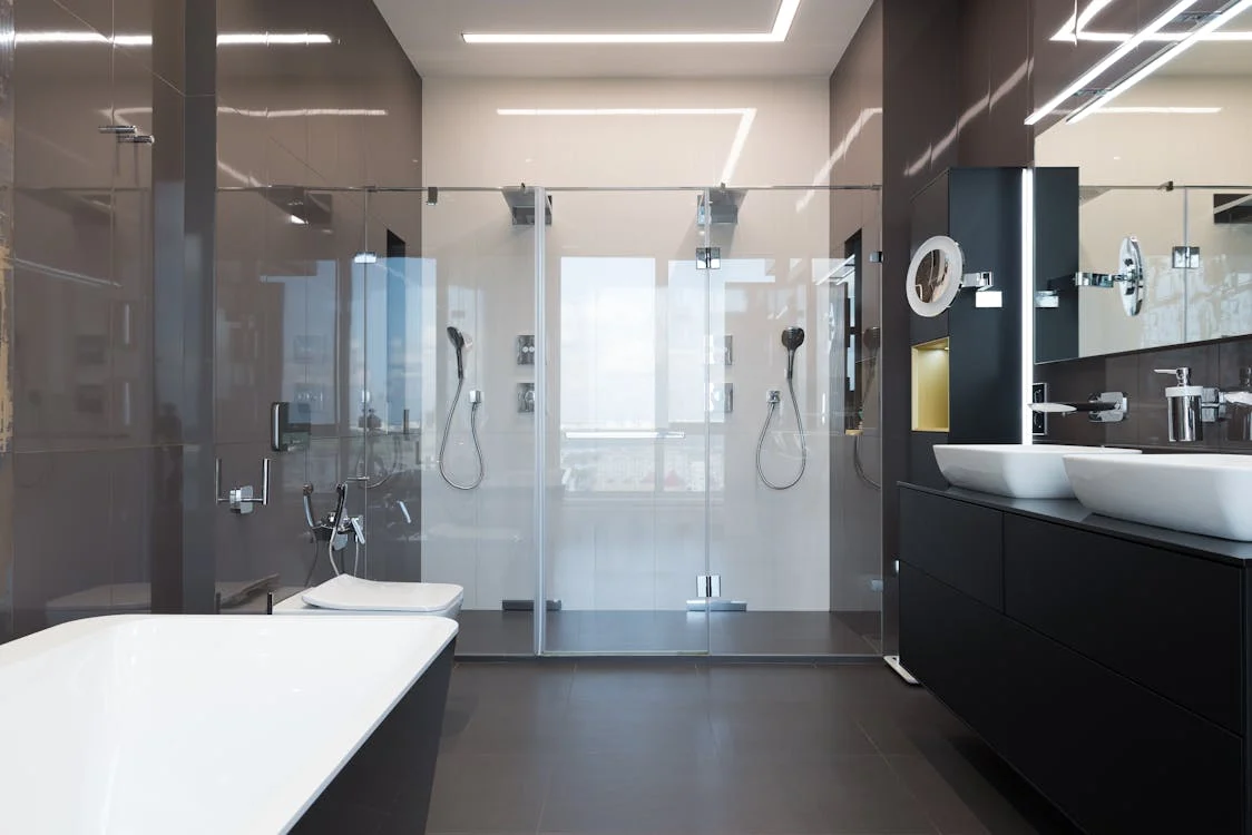 Large bathroom with multi-panel roll-in shower.